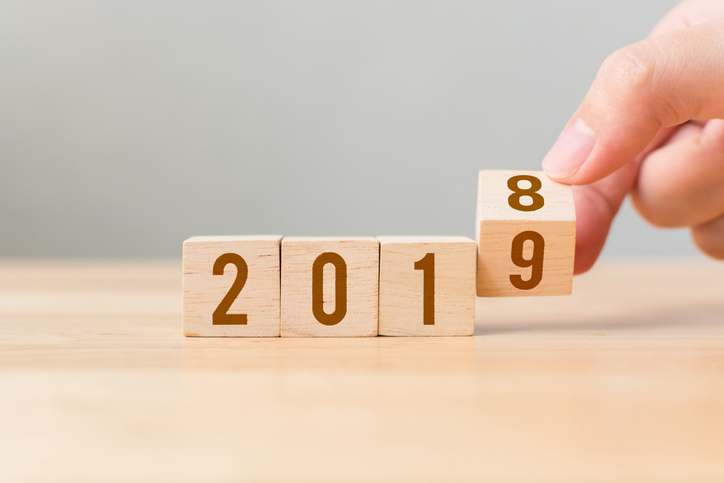 New year 2018 change to 2019 concept. Hand flip over wood cube block New year 2018 change to 2019 concept. Hand flip over wood cube block