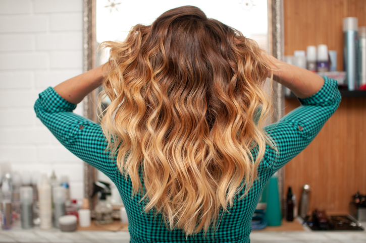 Beautiful ombre hair coloring on a girl with long hair, view from the back Beautiful ombre hair coloring on a girl with long hair, view from the back