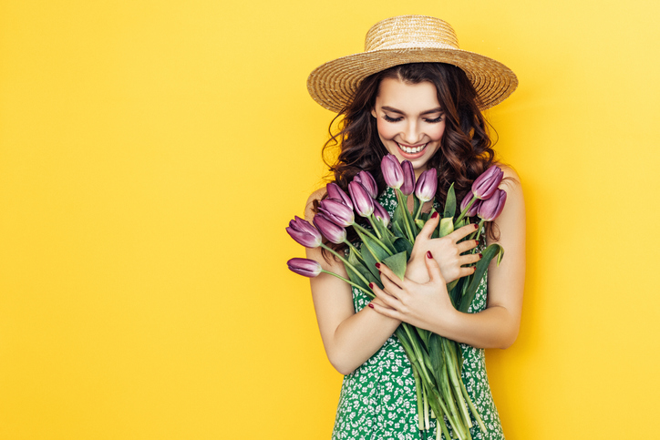 Lovely woman with purple tulips bunch Lovely woman with purple tulips bunch